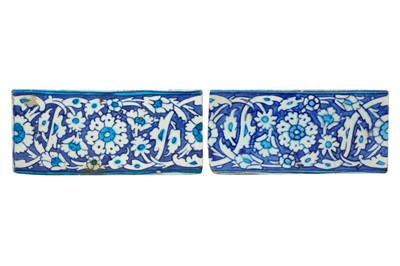 Lot 70 - A PAIR OF OTTOMAN BLUE AND WHITE IZNIK POTTERY BORDER TILES