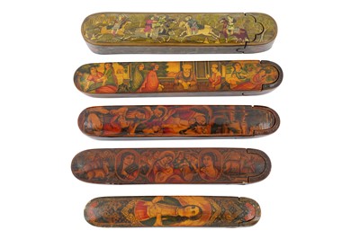 Lot 48 - FIVE LACQUERED PAPIER-MÂCHÉ PEN CASES (QALAMDAN) WITH QAJAR MAIDENS AND GROUP GATHERINGS