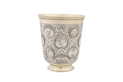 Lot 228 - A mid-18th century German parcel gilt silver coin set beaker, Berlin circa 1740 maker’s mark obscured