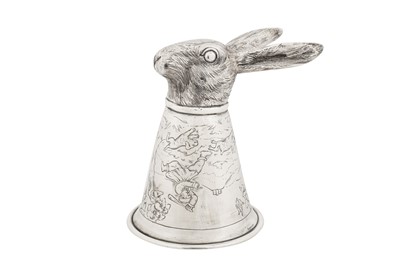 Lot 41 - An early 20th century German sterling silver stirrup cup, Hanau by Neresheimer, import marks for Chester 1909 by Berthold Muller