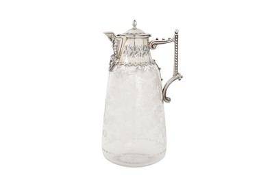 Lot 366 - A Victorian sterling silver mounted glass claret jug, London 1873 by Martin, Hall and Co