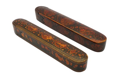 Lot 53 - TWO QAJAR LACQUERED PAPIER-MÂCHÉ PEN CASES (QALAMDAN) WITH PORTRAITS AND GOL-O-BOLBOL MOTIFS