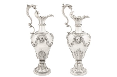 Lot 379 - A large pair of Victorian sterling silver ewers, London 1868 by George Fox