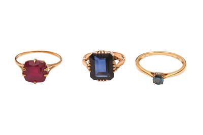 Lot 13 - THREE SYNTHETIC GEM-SET RINGS