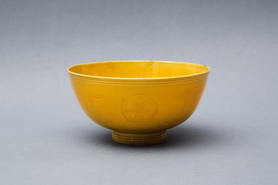 Lot 143 - A CHINESE MONOCHROME INCISED YELLOW-GLAZED BOWL