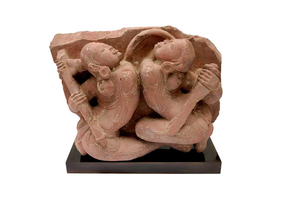 Lot 101 - A CARVED RED SANDSTONE FIGURE OF FEMALE WARRIORS