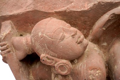 Lot 101 - A CARVED RED SANDSTONE FIGURE OF FEMALE WARRIORS