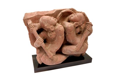 Lot 101 - A CARVED RED SANDSTONE FIGURE OF FEMALE WARRIORS