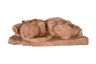 Lot 101 - A CARVED RED SANDSTONE FIGURE OF FEMALE WARRIORS
