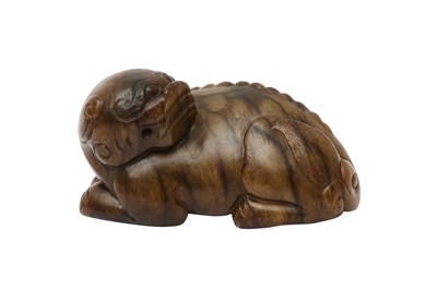 Lot 128 - A CHINESE BROWN JADE CARVING OF A MYTHICAL BEAST