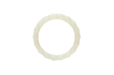 Lot 934 - A CHINESE PALE CELADON JADE BANGLE