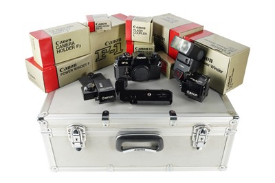 Lot 224 - A Canon F-1 SLR Camera with Accessories.
