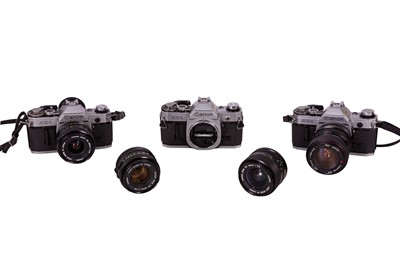 Lot 228 - Three Canon AE-1 bodies with lenses.
