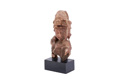 Lot 100 - A FRAGMENTARY CARVED RED SANDSTONE STATUE OF LORD SHIVA