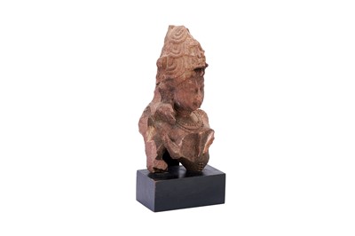 Lot 100 - A FRAGMENTARY CARVED RED SANDSTONE STATUE OF LORD SHIVA