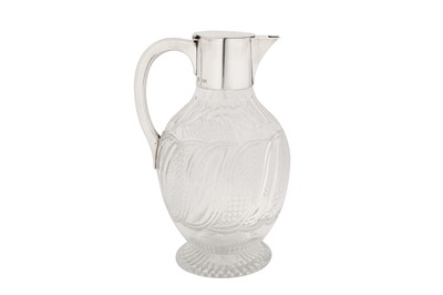 Lot 360 - A Victorian sterling silver mounted glass claret jug, London 1891 by Hukin and Heath
