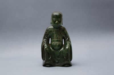 Lot 184 - A CHINESE SPINACH-GREEN JADE FIGURE OF AN IMMORTAL
