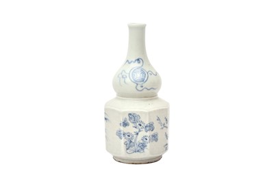 Lot 99 - A KOREAN BLUE AND WHITE OCTAGONAL BOTTLE VASE