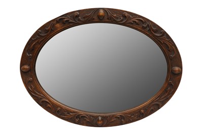 Lot 210 - A FRUITWOOD OVAL MIRROR