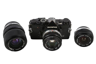 Lot 357 - A Black Olympus OM1 MD Outfit.