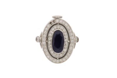 Lot 47 - A SAPPHIRE AND DIAMOND WATCH RING