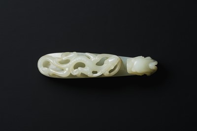 Lot 117 - A CHINESE PALE-CELADON JADE 'CHILONG' BELT HOOK