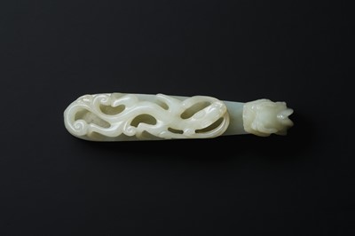 Lot 119 - A CHINESE PALE-CELADON JADE 'DRAGON' BELT HOOK