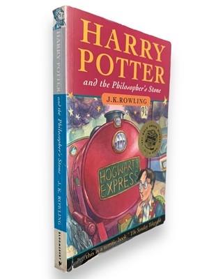 Lot 298 - Rowling. Harry Potter and the Philosopher's Stone, 9th printing paperback Signed by Author 1997