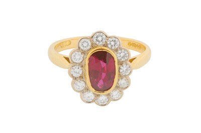 Lot 118 - A RUBY AND DIAMOND CLUSTER RING