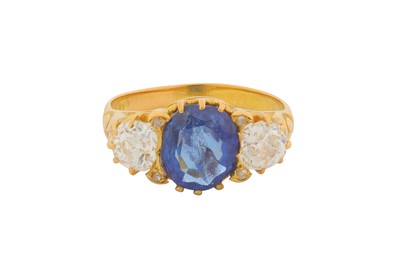 Lot 32 - A THREE-STONE SAPPHIRE AND DIAMOND RING