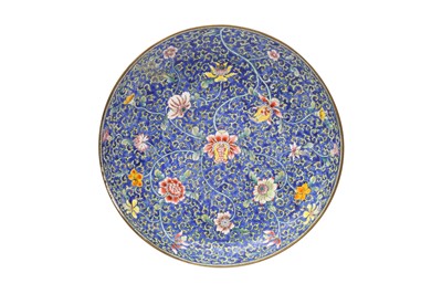 Lot 117 - A CHINESE CANTON ENAMEL BLUE-GROUND 'BLOSSOMS' DISH