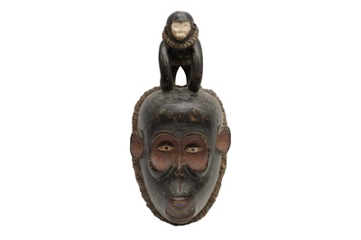 Lot 229 - A GABON MBULU CARVED AND PAINTED WOOD MONKEY MASK