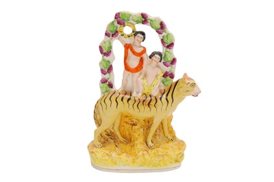 Lot 201 - AN EARLY 19TH CENTURY STAFFORDSHIRE FLATBACK FIGURE WITH A TIGER