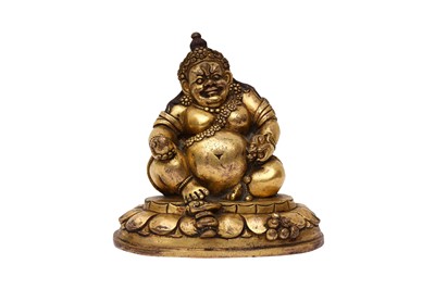 Lot 577 - A TIBETAN GILT-BRONZE FIGURE OF VAISRAVANA