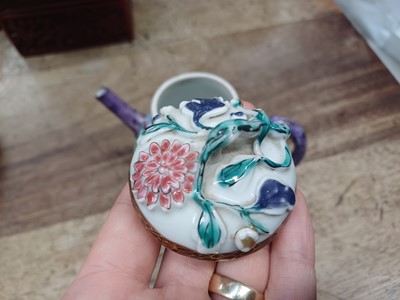 Lot 421 - A CHINESE FAMILLE-ROSE MOULDED 'BLOSSOMS' TEAPOT, COVER AND SAUCER