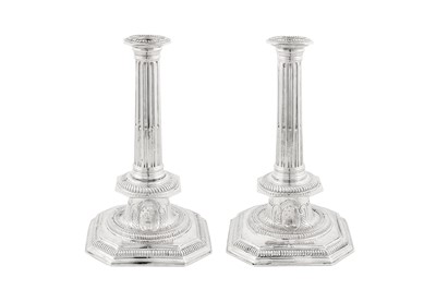 Lot 479 - A large pair of Queen Anne Britannia standard silver candlesticks, London 1705 by John Barnard I