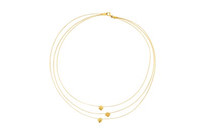 Lot 156 - A THREE-STRAND NECKLACE