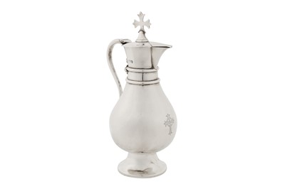 Lot 326 - A George V sterling silver ecclesiastical wine flagon, London 1914 by J Wippell and Co Ltd