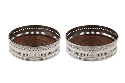 Lot 442 - A pair of George III sterling silver wine coasters, London 1792 by William Abdy II