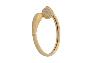 Lot 334 - UNIVERSAL GENEVE. 18CT GOLD BANGLE WATCH