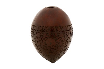 Lot 97 - A 19TH CENTURY PERSIAN QAJAR CARVED COCONUT HUQQA BASE
