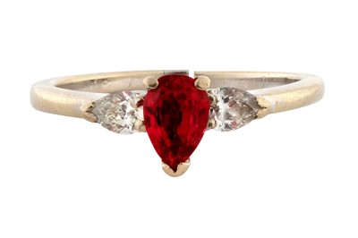 Lot 119 - A RUBY AND DIAMOND THREE-STONE RING