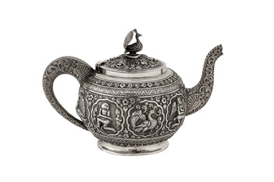 Lot 116 - A late 19th / early 20th century Anglo - Indian unmarked silver teapot, Madras circa 1900