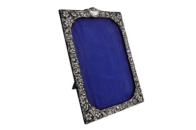 Lot 34 - An Edwardian sterling silver photograph or mirror frame, Birmingham 1902 by Henry Matthews