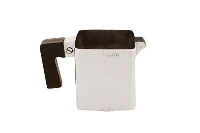 Lot 312 - An Elizabeth modernist sterling silver milk jug, London 1974 by S&B