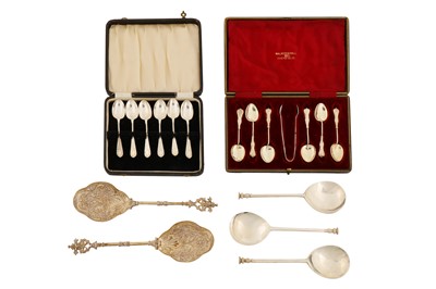 Lot 145 - A pair of Edwardian sterling silver fruit serving spoons, London 1909 by Goldsmiths and Silversmiths