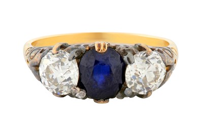 Lot 39 - A SAPPHIRE AND DIAMOND THREE-STONE RING