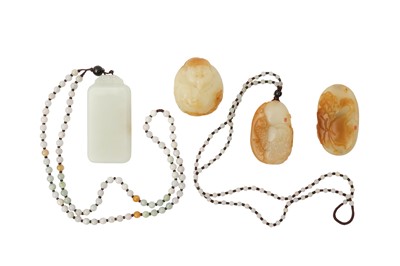 Lot 569 - FOUR CHINESE JADE PENDANTS