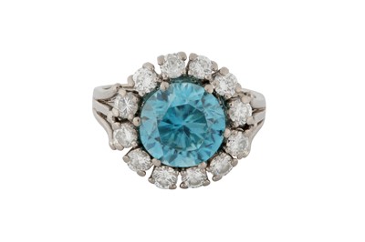 Lot 79 - A BLUE ZIRCON AND DIAMOND CLUSTER RING