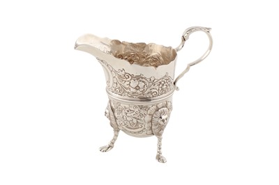 Lot 118 - An early 20th century Irish sterling silver cream jug, Dublin 1925 by Charles Lambe